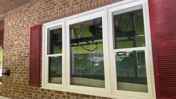 New double-hung window installation on brick home